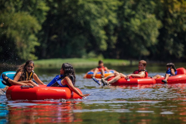 Tubers floating down the river with the current