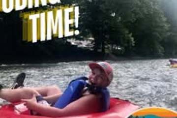 a person riding on the back of a boat